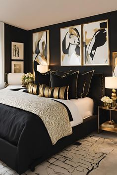 a bedroom with black walls and gold accents, white bedding and artwork on the wall