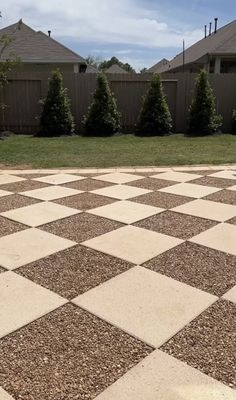 a black and white checkerboard pattern is in the yard