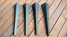 three different types of knives on a wooden table