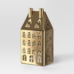 a gold metal house shaped like a building