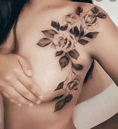 a woman with a flower tattoo on her chest