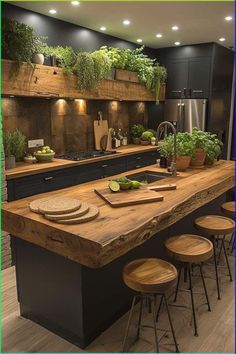 a kitchen with an island made out of wood and plants on the counter top, surrounded by stools