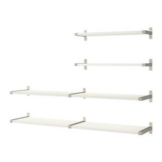 four white shelves with metal brackets on each shelf