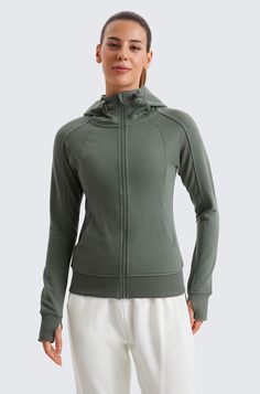 The cotton blended fabric is ultra-soft and breathable naturally. Micro fleece lining offers a cozy feeling. Full-zip hoodies with high collars and thumb holes add athletic style and keep warm. Designed for on-the-go or lounge. [[cur-off]] [[flare]]{{Details}}   55% Cotton, 37% Modal, 8% Elastane   Perfect for workouts and lounging   Cotton modal blended light fleece lined fabric for cozy, warm and breathable feel   Classic fit, hip length   Thumbholes keep sleeves in place   Two side pockets with hidden pockets for storage   Full length zipper with adjustable hood drawstring design keeps the cold from seeping in Zip Hoodies, Athletic Style, Cozy Feeling, Athletic Fashion, Cotton Fleece, White Hoodie, Thumb Holes, Full Zip Hoodie, Grey Hoodie