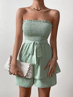 Show off your style in this Trim Shirred Belted Tube Romper. This romper features a strapless neckline, sleeveless design, and high-waisted fit for an ultra-flattering look. The mint green color is complemented by the contrast lace, frill, and shirred details for added charm. It is crafted from lightweight woven fabric with a slight stretch that allows you to move comfortably at all times. Plus, it comes with a matching belt to add definition to your waistline. Perfect for any special event or party, this romper will make sure you look stylish yet feel comfortable all night long! Features: Color: Mint Green Pattern Type: Plain Details: Belted, Contrast Lace, Frill, Shirred Length: Short Type: Tube Fit Type: Regular Fit Neckline: Strapless Sleeve Length: Sleeveless Waist Line: High Waist Fa Tube Romper, Comfy Jumpsuits, Mint Green Color, Strapless Neckline, Green Pattern, No Frills, Special Event, Green Color, Mint Green