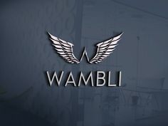 the logo for wambli is displayed on a wall in front of a window