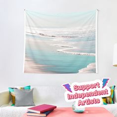 a wall hanging in a living room with a sign that says support independent artists