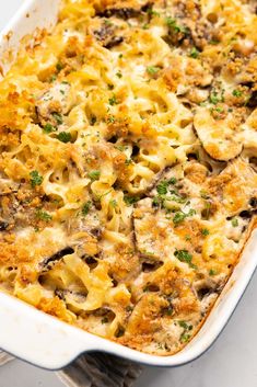 a casserole dish filled with pasta and mushrooms