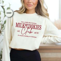 Celebrate the joy of Christmas with this Comfort Colors long sleeve shirt, featuring the charming "Milk & Cookies Club" print. Designed for those who embrace holiday cheer, this shirt is perfect for cozy winter nights and spreading the festive spirit. Made with high-quality, soft fabric, it ensures comfort throughout the holiday season. 🛍️HOW TO ORDER: 1️⃣To begin, select the desired size from the drop-down menu. 2️⃣Next, choose the primary color. 3️⃣Then, choose the desired quantity. 4️⃣Finally, click on the "Add to Cart" button. 🌟🌟If you're interested in purchasing another product with a different design or size, simply add it to your cart from the product page. PRODUCT FEATURES: - Comfort Colors Brand long sleeve shirts are made with the highest quality materials from the Comfort Col Winter Gift Long Sleeve Sweatshirt, Cookie Brand Shirt, Hot Cocoa Christmas Shirt, Christmas Cookie Baking Shirts, Cozy Long Sleeve Christmas Sweatshirt, Cute Christmas Shirts, Milk Cookies, Club Shirts, Boys Hoodies