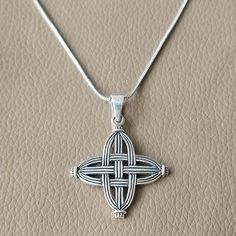 St. Brigid, an abbess, patron saint of Ireland, and founder of the first Irish monastery, is also known as "Mary of the Gael". Born in Dundalk, she is credited with creating the unique rush or straw cross that bears her name, which is believed to protect against evil, fire, and hunger. This pendant is handmade exclusively by me, not mass-produced in a factory. When you order, you can be assured your piece will be one-of-a-kind. I craft each pendant to order within 3-4 days. Length: 28 mm Width: 28 mm wegiht : 5.2 g It is in excellent, new condition. I ship worldwide via registered airmail with a tracking number so you can follow its progress. Every order receives personalized attention and care. (This product comes without necklace) Irish Druid, St Brigid Cross, Brigid's Cross, St Brigid, Goddess Jewelry, Irish Celtic, Jewelry Sterling Silver, Religious Jewelry, Silver 925