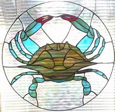 a stained glass window with a crab on it