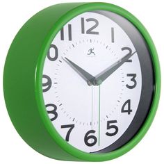 a green and white clock with numbers on the face is shown in front of a white background