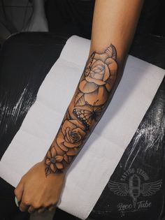 a person with a flower tattoo on their arm