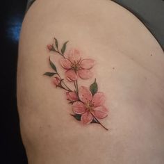 a woman's stomach with pink flowers on it