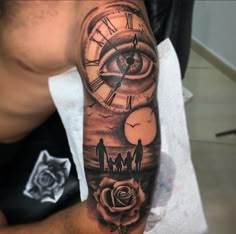 a man with a clock tattoo on his arm