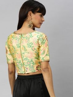 Woven cream crop top online for women which is crafted from brocade fabric with stunning woven fancy work. Floral Embroidered Brocade Sets, Floral Embroidery Choli For Festivals, Fitted Embroidered Top With Motifs, Fitted Embroidered Top With Zari Work, Festive Crop Top With Pallu, Fitted Cropped Embroidered Blouse, Cropped Floral Embroidered Blouse, Fitted Embroidered Cropped Blouse, Fitted Padded Blouse Crop Top For Festive Occasions