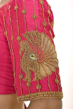 Introducing the Pink Aari Work Bridal Blouse in Pure Silk—a timeless blend of elegance and tradition. Crafted from luxurious pure silk, this stunning bridal blouse features a graceful U-neckline and elegant elbow-length sleeves. The intricate Aari work motifs delicately adorn the blouse, adding a rich and sophisticated touch to your bridal ensemble. Perfect for brides who seek a classic yet refined look, this blouse beautifully complements any saree or lehenga, making it an ideal choice for your special day. Tissue Silk Blouse For Wedding, Silk Blouse Piece For Reception With Traditional Drape, Elegant Art Silk Blouse For Reception, Elegant Semi-stitched Silk Sherwani, Formal Saree Blouse Piece With Intricate Embroidery, Formal Unstitched Saree With Intricate Embroidery, Formal Silk Saree With Embroidery, Silk Sherwani With Zari Work For Wedding, Elegant Silk Sherwani With Traditional Drape