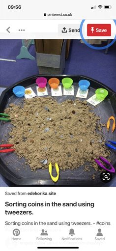 a tray filled with dirt and scissors on top of a table