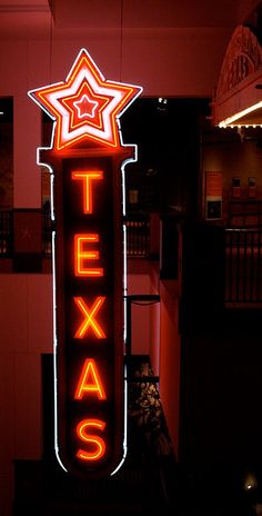 a neon sign that says texas on it