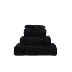 black towels stacked on top of each other