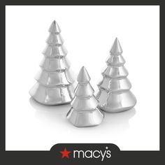 three silver christmas trees are shown with the words macy's on it and an image of