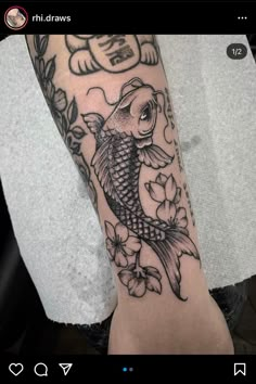 a person with a tattoo on their arm that has a koi fish in it