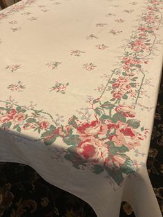 a white table with pink flowers on it