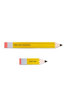 two pencils with the words first day of school written on them