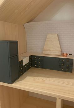 a model kitchen with cabinets and a stove