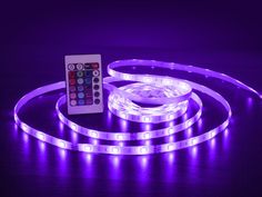 purple led strip with remote control on dark surface