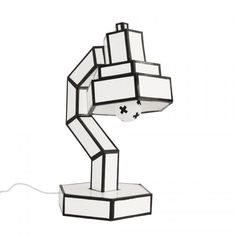 a lamp that is shaped like a robot with its arm extended and head turned upside down