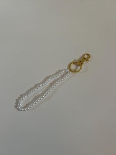 The Classic Pearl Keychain is the perfect accessory to attach to your car keys, wallet, backpack, purse, or more. The timeless elegance of the pearls and the accompanied gold finish will never grow old. Pearl Keychain, Never Grow Old, Growing Old, Car Keys, Backpack Purse, Gold Finish, Keychains, Timeless Elegance, Purse