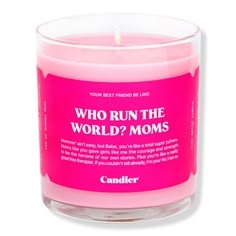 a pink candle that says, who run the world? moms