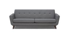 a gray couch sitting on top of a white floor