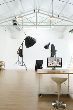 an empty room with several lighting equipment on the table