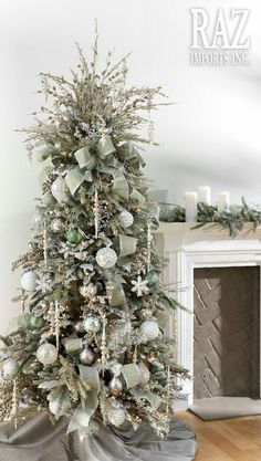 a decorated christmas tree with silver and white ornaments