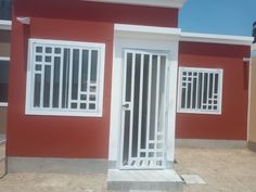 a red house with white doors and windows