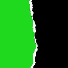 a torn piece of green paper with white edges on a black background that is half - cut in half