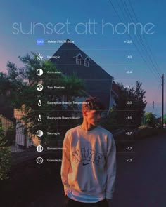 a man standing in front of a house with the words sunset at home on it