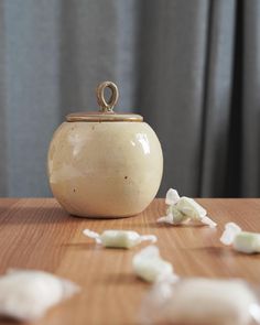 a white container sitting on top of a wooden table