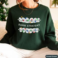 Looking for an ugly Christmas sweater gift for your dentistry office team or dentist?   Have a giggle this Christmas at your orthodontist office or dental office with the Christmas version of our popular Damn Straight orthodontics shirt. These are perfect for any dental office staff, dental assistant, dental school student, or dentist/orthodontist to wear to work.  Plus, they make great staff appreciation gifts for your new dental school graduate or whole Orthodontic dentistry team, and make a l Ortho Assistant, Orthodontist Office, Office Xmas Party, Dental Christmas, Christmas Gift Her, Dentistry Office, Staff Appreciation Gifts, Office Team, Dental School