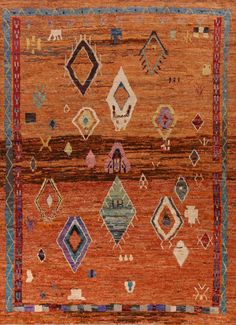 an orange and blue rug with many different designs