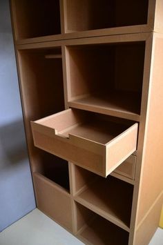 the shelves are made out of cardboard and have drawers