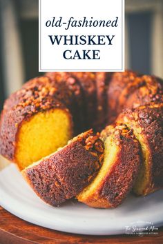 an old fashioned whiskey cake on a white plate