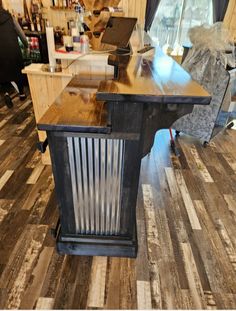 a kitchen island made out of wood and metal