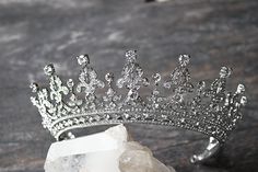 QUEEN VICTORIA 2 Tiara © WHAT WE LOVE The QUEEN VICTORIA 2 Tiara is an even more regal version of our much loved and favorite tiara, the QUEEN VICTORIA Tiara. This version of the tiara goes around the head 13.4 inches (34 CM), so it has almost a crown affect without being an actual full crown since it goes about 2/3 around the head. Absolutely GORGEOUS in person. DETAILS A truly BEAUTIFUL and elegant Swarovski Crystal Bridal Tiara with absolutely amazing sparkle factor! One of our absolute FAVOR Crystal Bridal Tiaras, Beautiful Tiaras, Princess Madeleine, Diamond Tiara, Gown Photos, Real Jewelry, Bridal Show, Bridal Crown, Bridal Tiara