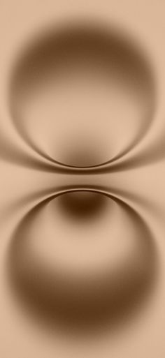 an abstract image of two circles in brown and beige colors, with the light reflecting on them