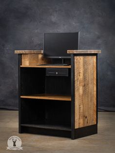 a computer desk made out of wood and metal with a laptop on top of it