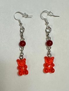 Gummy Bear Earrings Gummy Bears are plastic, the other 3 beads are glass. The metal fixings are made of iron. Fun Red Resin Earrings, Fun Style Red Resin Earrings, Red Resin Novelty Earrings, Fun Red Resin Jewelry, Red Resin Novelty Jewelry, Novelty Red Resin Jewelry, Red Plastic Earrings For Gift, Handmade Red Plastic Earrings, Fun Red Plastic Jewelry