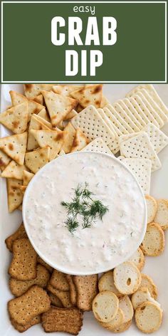 a plate with crackers and dip on it, next to crackers in the background